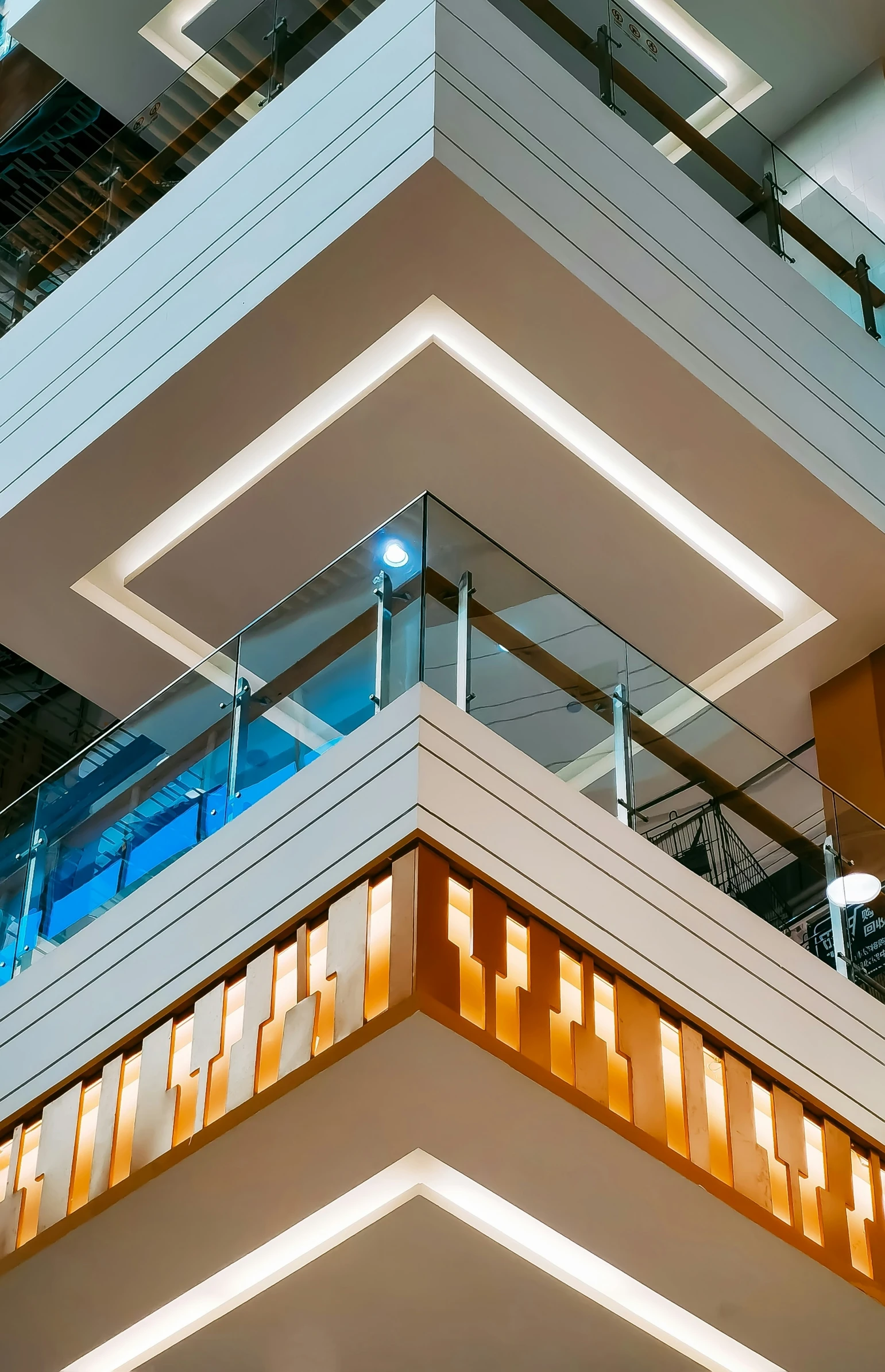 a large room with some glass and a staircase