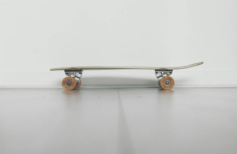 a skateboard is on a surface with some white walls