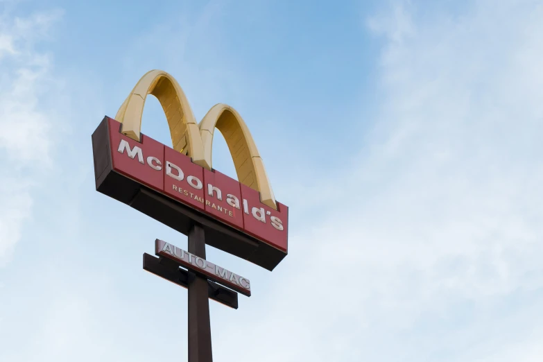 an advertit for mcdonald's is on the roof of a building