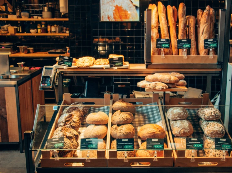 an assortment of bread on display at a store