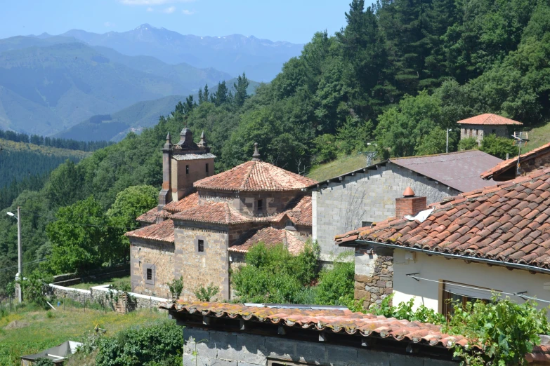 some buildings are perched on a hill side