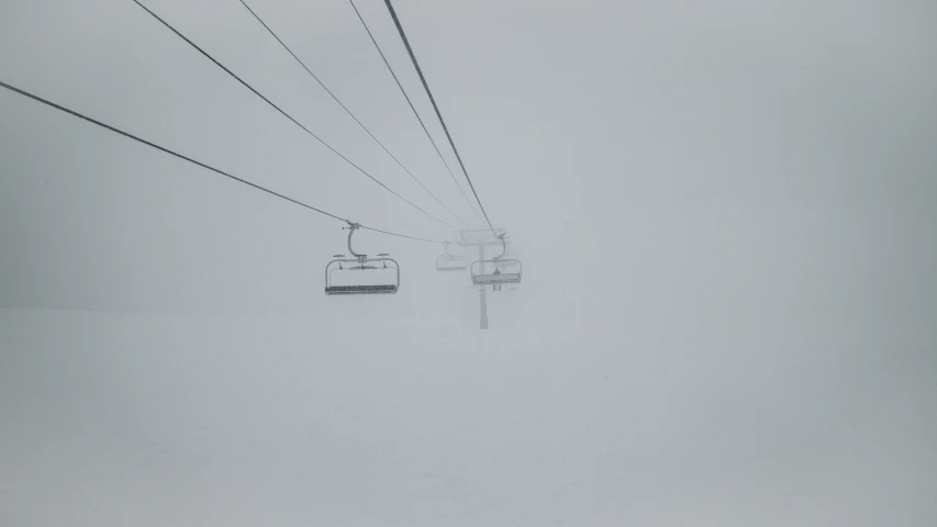 a snow filled sky with lots of wires above it