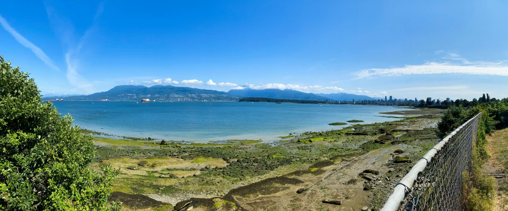 a view from the shore of a large body of water