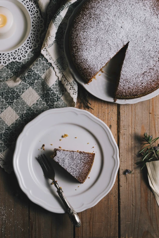 cake sitting on plates with a knife next to it