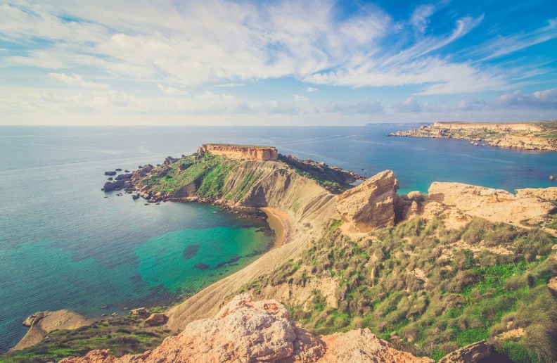 an island sits on the coast near the water