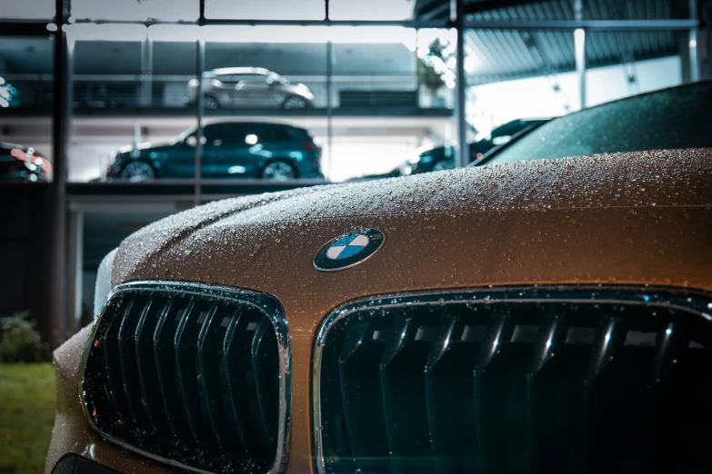 three different colored cars in an automobile showroom