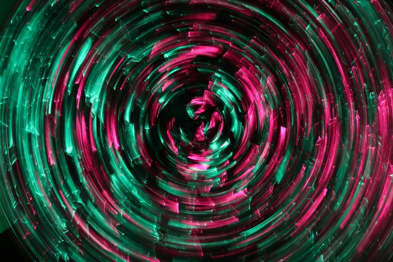 a very beautiful green and red swirl on a black background