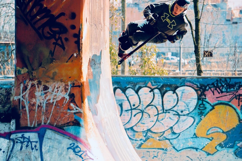 a man riding on top of a ramp on top of a skateboard