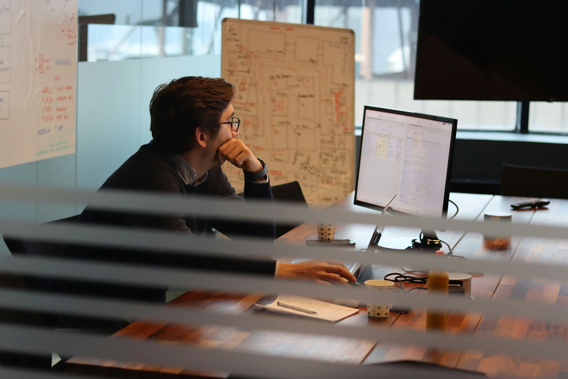 man sitting at desk in an office setting