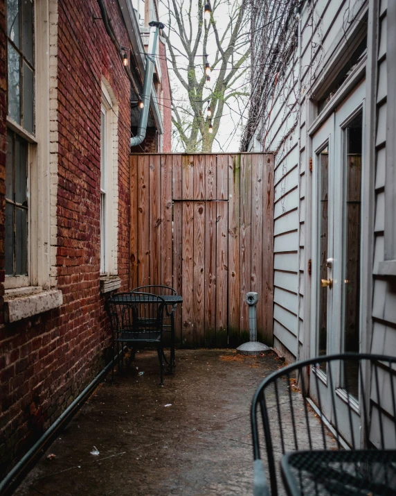 an old back yard with a chair and table