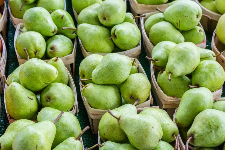 there is a green box filled with green apples