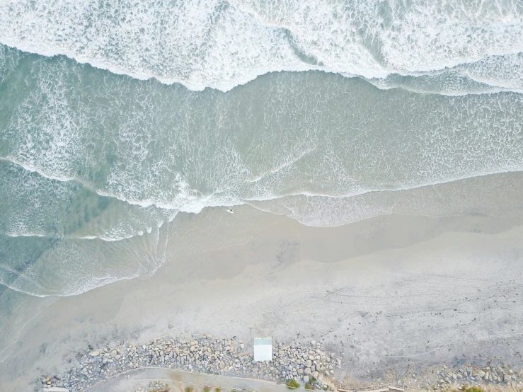 an aerial s of the ocean near the beach