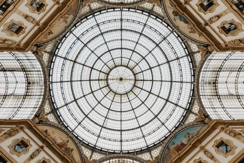 two people in front of an ornate glass dome