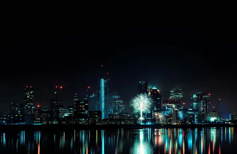 bright lights shine over city skyline at night