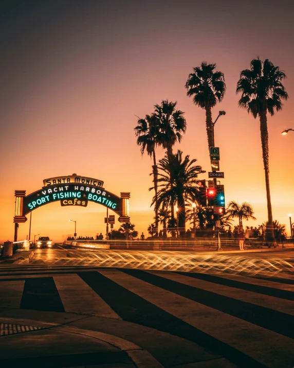 a street with palm trees in the background