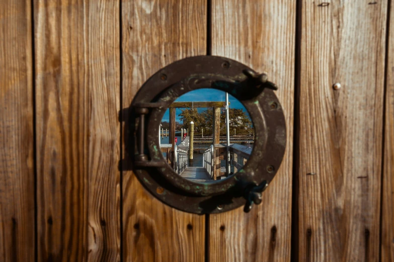 the back side of a building with wooden panels in front of it