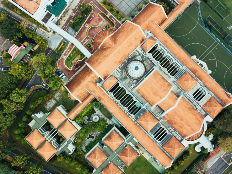 a aerial view of a courtyard with many orange roof tiles