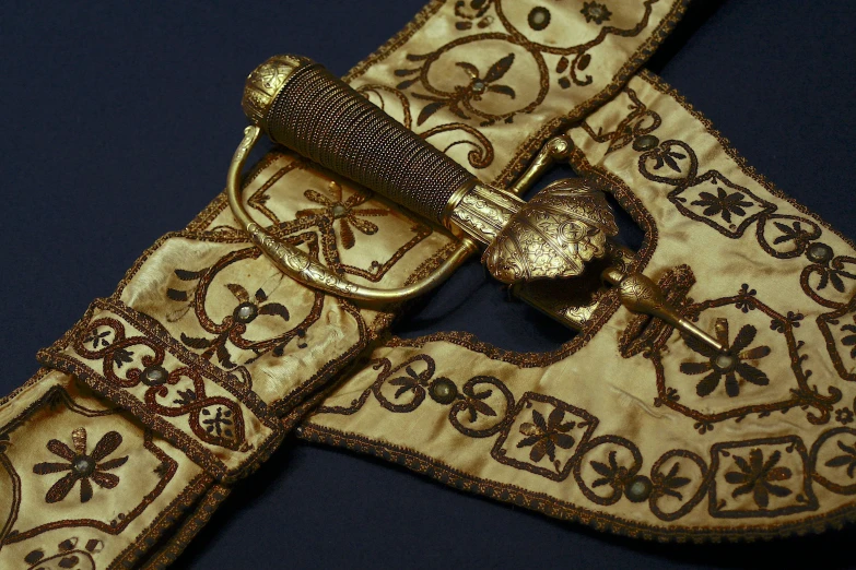 a cloth and gold belt with fancy patterns