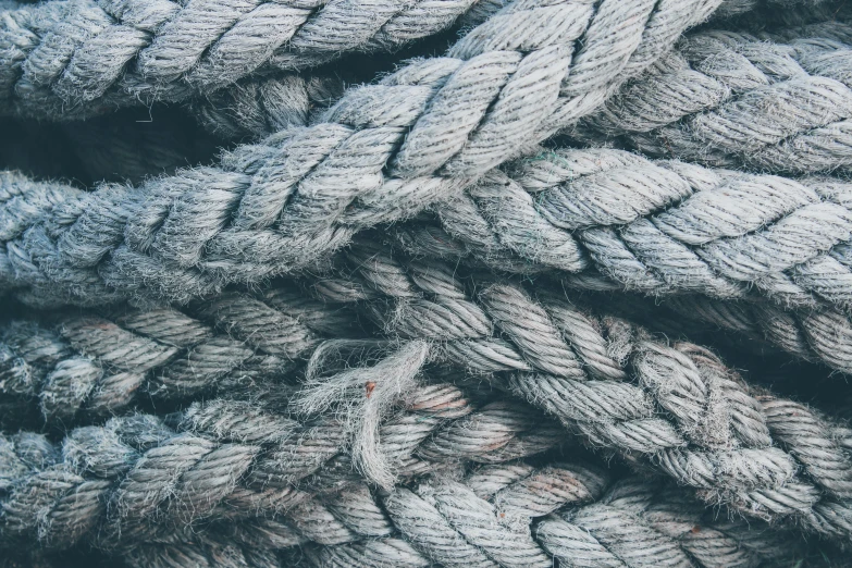 multiple ropes of gray color in a pile