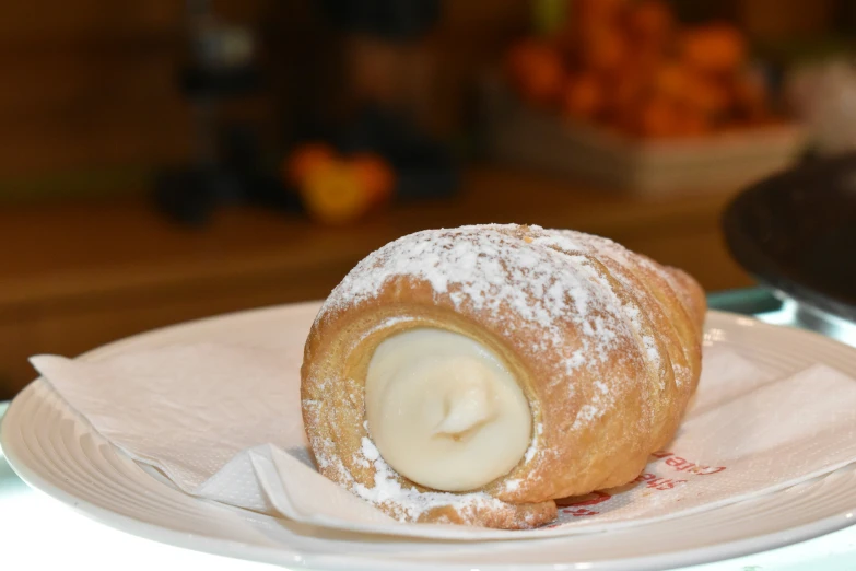 a small doughnut is sitting on a plate