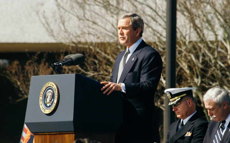 a man that is standing at a microphone