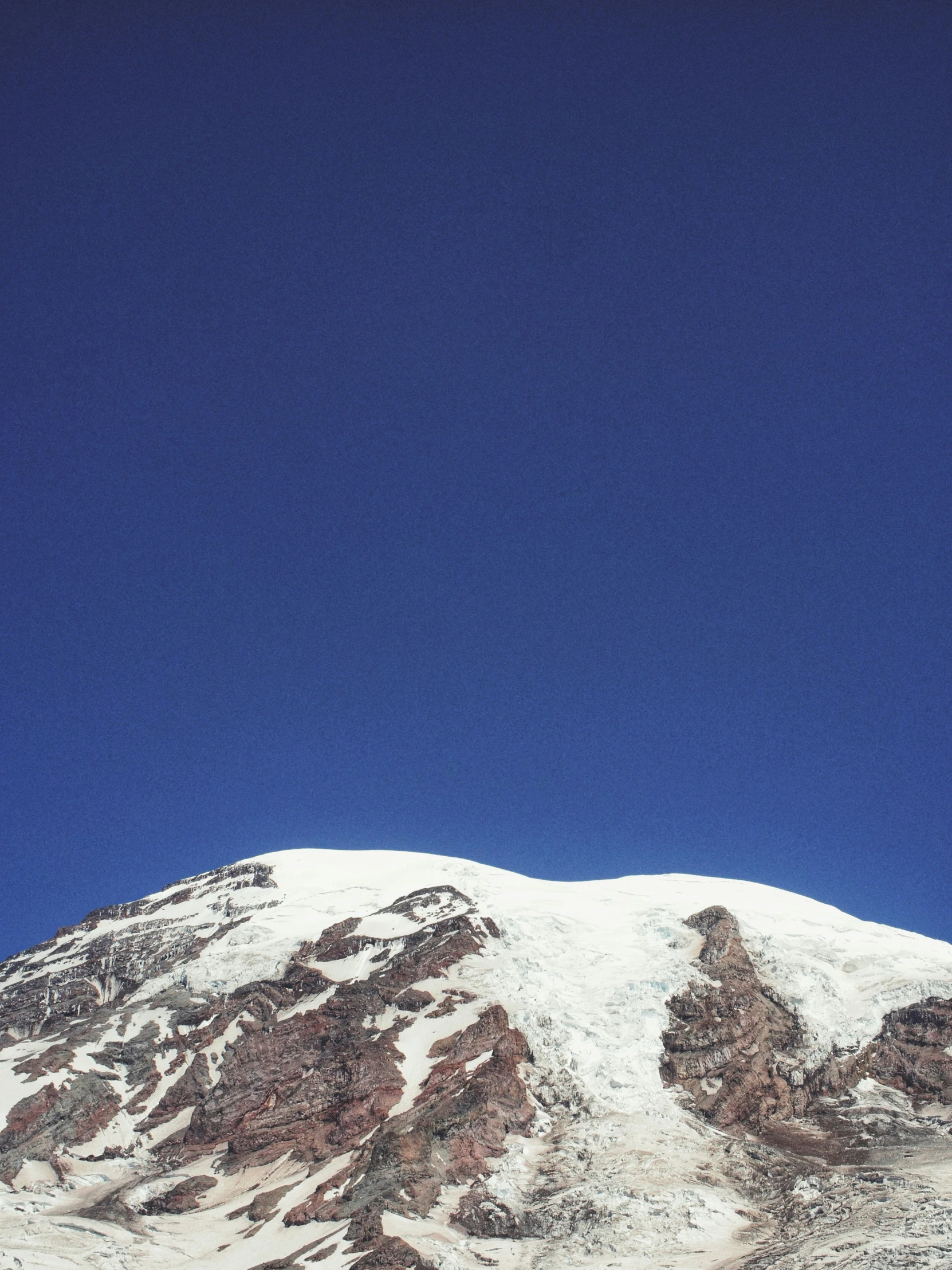 the person is jumping up in the air on a snowboard