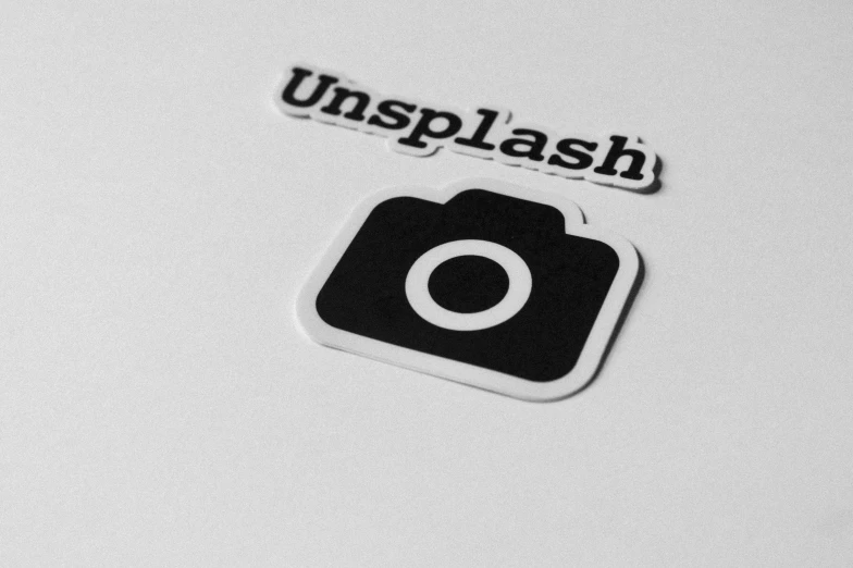 a white plate holding the unplash logo