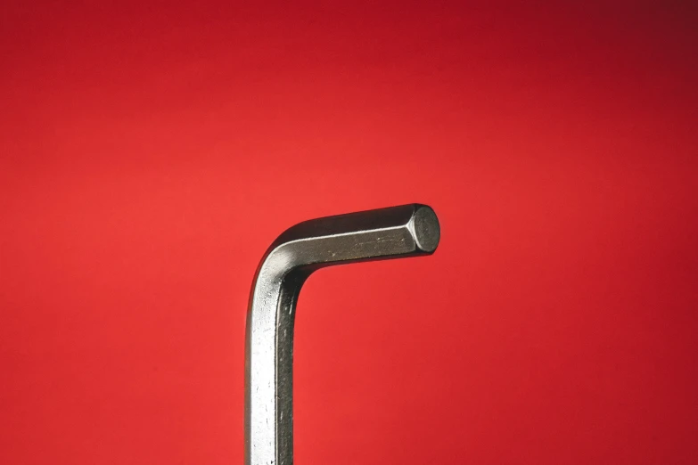 a steel pipe on a red background