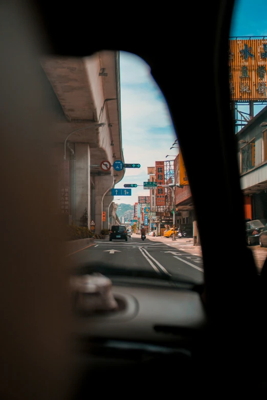 the front window of a car is shown, as if in the rear view mirror