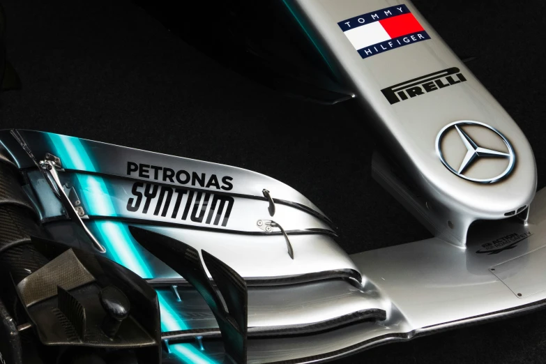 the front end of a mercedes racing car with the name on it