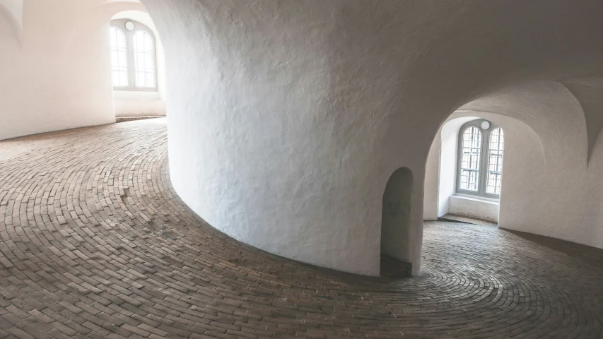 an unusual walkway inside of a very large building