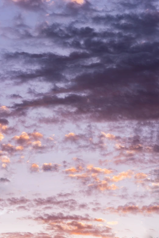 the view of the sky as a few clouds are rolling in