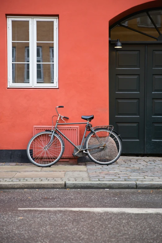 a bike parked on the side of a street