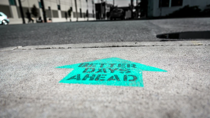 a picture of a street sign on a sidewalk