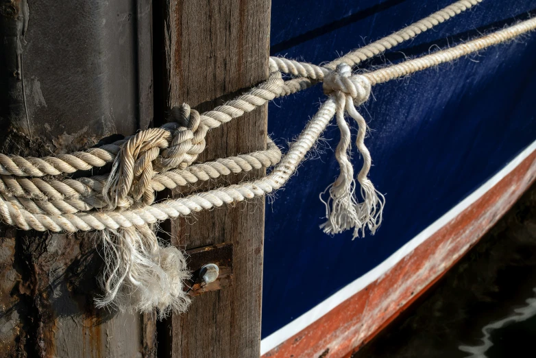 rope and knots connected to the side of a boat