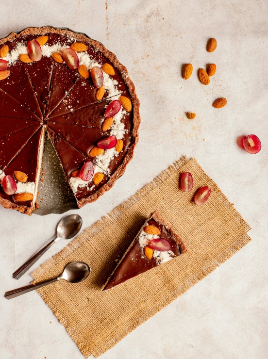 a chocolate pie, a knife and other dessert item on table