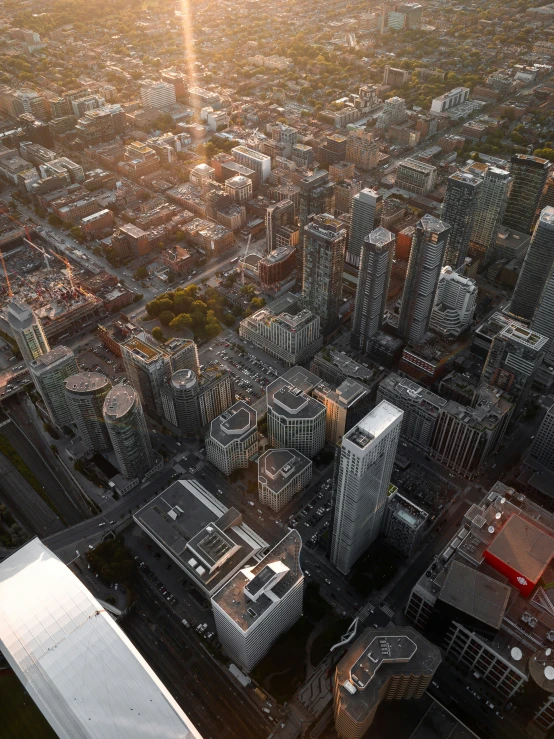 the aerial view of a city with lots of tall buildings