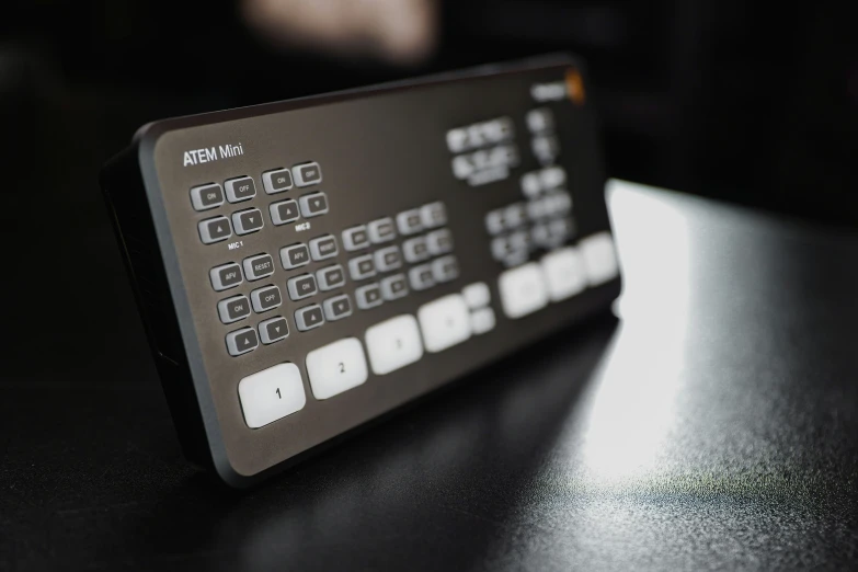 a close up of a remote control on a table