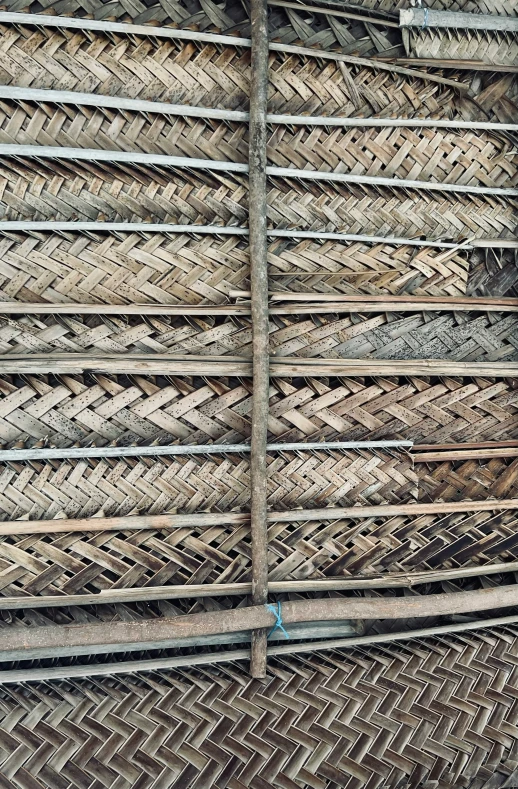 a man is standing next to some kind of wooden structure