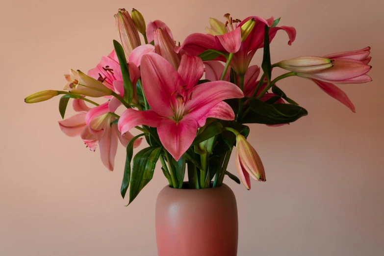 a vase full of flowers on a wooden table