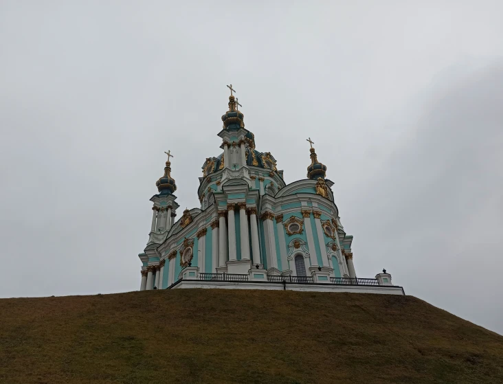 a large building with towers and other buildings around it