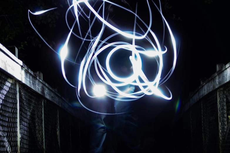 bright light painting of a fence at night