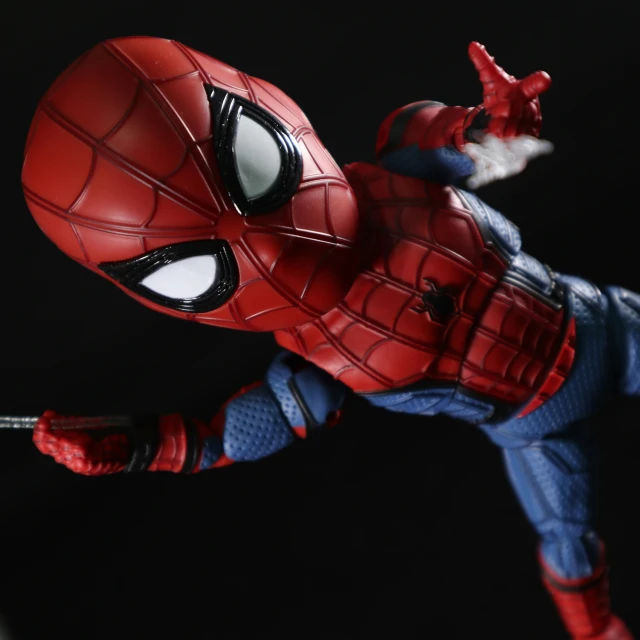 the spider - man action figure is posing for a picture