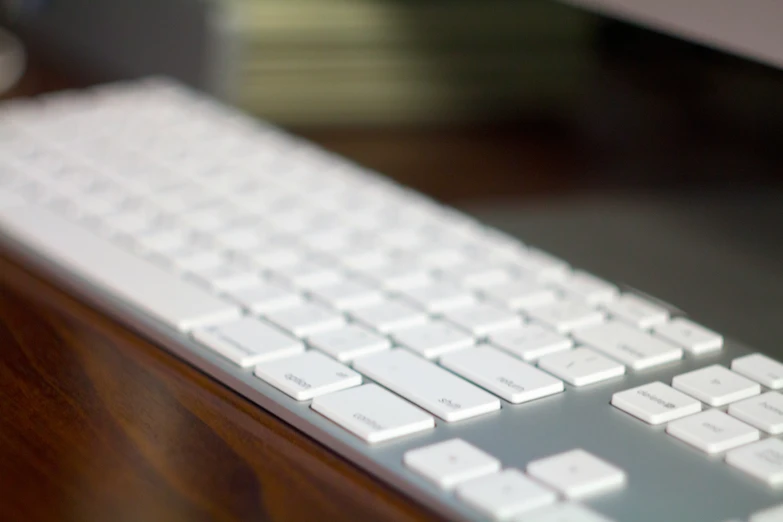 a keyboard is shown sitting on a desk