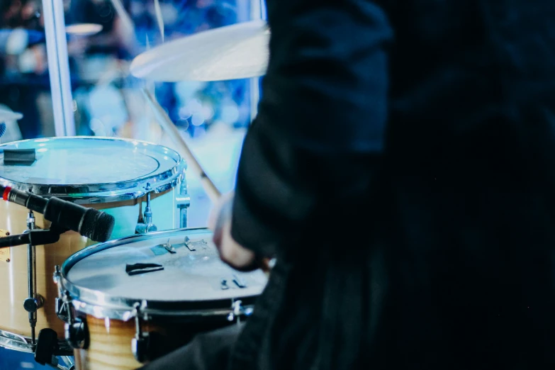 a drummer is shown playing the drums on stage