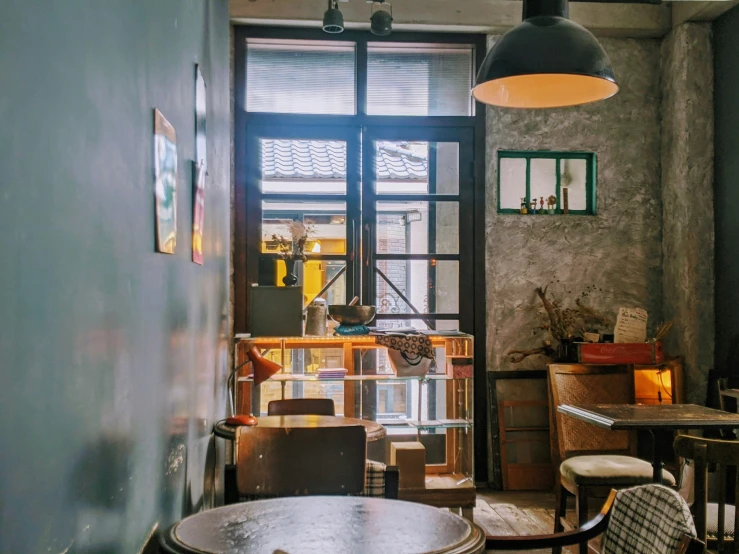 an old fashioned shop with tables and chairs