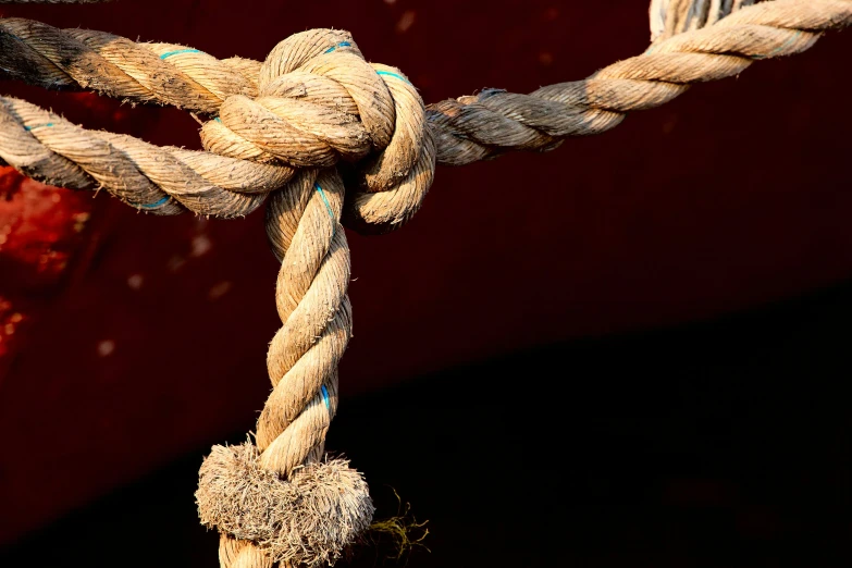 closeup s of rope hanging down on a boat