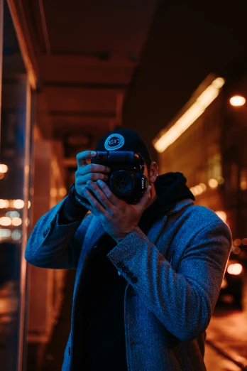 man taking a po in the dark with his camera