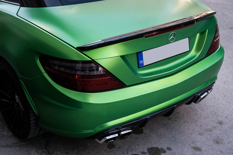 a very nice looking car with an interesting green paint job