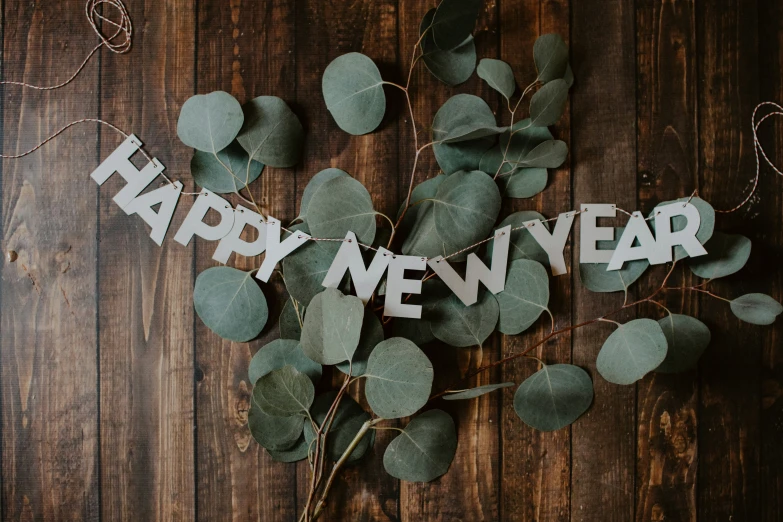 a sign that says happy new year on a table